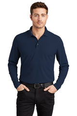 Male model in navy OGIO Caliber2.0 Long Sleeve OG105 polo with flat knit collar and 3-button placket.
